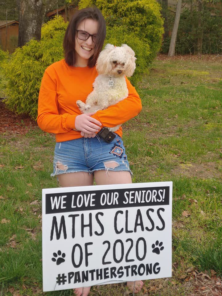 MTHS Senior with sign.jpg